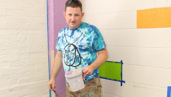TSgt Bryan Carrillo, of the Dyess We Care Team, helps to make Adaptive Recreation more colorful.
