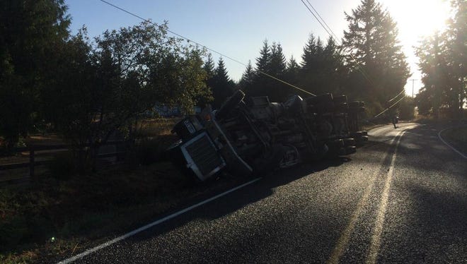 Log truck roll over crash on Crooked Finger Road.