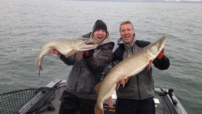 Two muskie catches in quick succession, plus a potential record-setter at another lake at roughly the same time, raise the question of solunar windows. Shown are columnist Jason Kron, left, and Kyle Johnson of Andover.