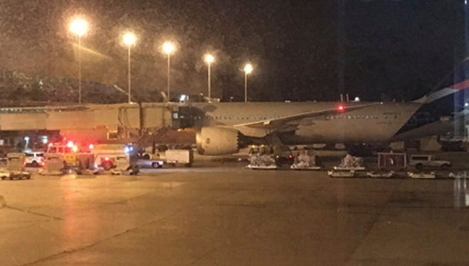 This photo provided by Shawn Woodward shows the scene on the tarmac at the Miami International Airport on Sept. 7, 2017. Police said they were investigating an officer-involved shooting Thursday night at the Miami airport that shut down a terminal as people looked to leave Florida ahead of Hurricane Irma.