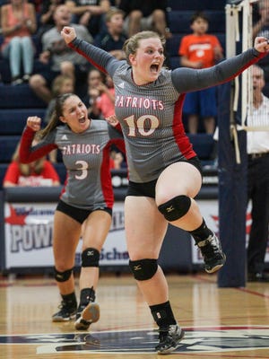 Powdersville junior Meara Matter, right, celebrates a point with teammate Karli O'Neill playing Palmetto during the fifth set Tuesday night at Powdersville High School in Greenville. Powdersville won 3-2.