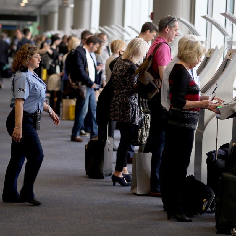 Passengers use the automated passport control kiosks set up for international travelers arriving at Miami International Airport on March 4, 2015 in Miami, Fla. The Department of Homeland Security unveiled a web page April 20, 2017, that allows travelers to compare expedited screening programs such as Global Entry and Precheck.