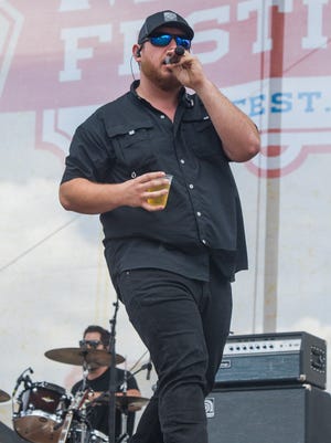 Luke Combs performs on the Riverfront Stage Sunday, June 11, 2017 during the CMA Music Festival in Nashville, Tenn.  