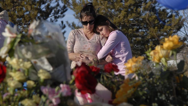 File photo: Aida Heiman of Reno comforts her daughter, Rachael, in February 2008 at a makeshift memorial where Brianna Denison's body was found.