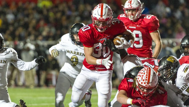 Center Grove senior Titus McCoy (30) has rushed for 462 yards and 10 touchdowns this season despite limited playing time because of injuries.