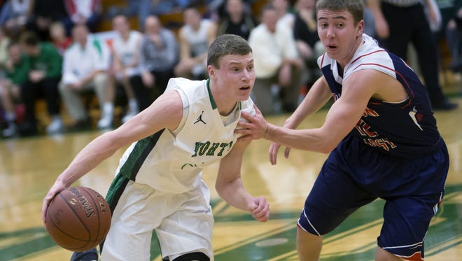 Shane Wissink (3) of Oshkosh North drives the ball around Appleton East's Trent Brunker (12) in a Fox Valley Association game on Tuesday.