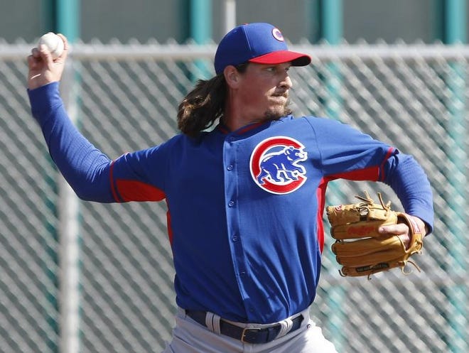 
Chicago Cubs starting pitcher Jeff Samardzija (29) throws out of the bullpen during camp at Chicago Cubs training facility at Mesa . 
