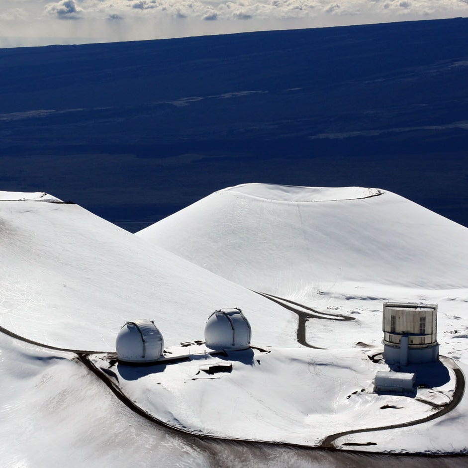 File photo: The astronomy observatories atop the snow-capped mountain of Mauna Kea are seen Tuesday, Jan. 6, 2009 near Hilo, Hawaii.