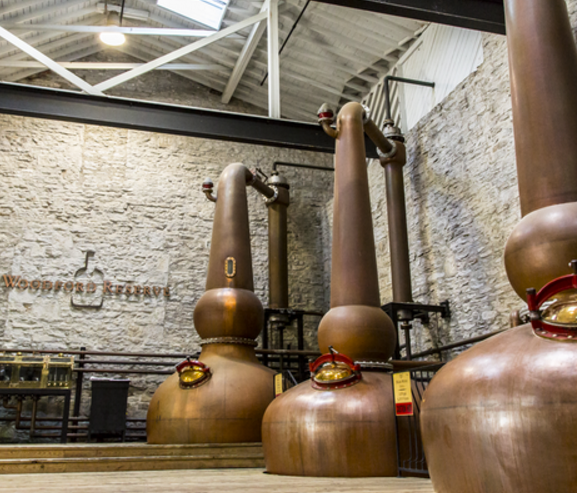 Woodford Reserve uses a series of three copper pot stills for distillation, a unique system for bourbon production or American whiskey of any variety.