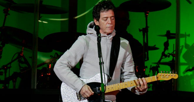 Lou Reed and his group perform at the Olympic Medals Plaza in Torino, Italy, in 2006.