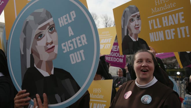Nuns supporting Little Sisters of the Poor attend a rally in front of the U.S. Supreme Court on March 23.