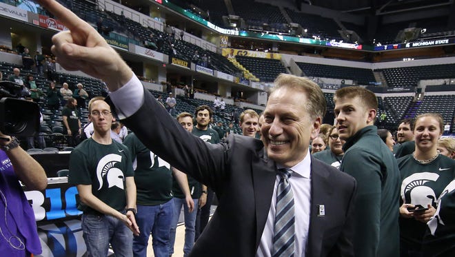 Michigan State coach Tom Izzo points into the stands March 13 at Bankers Life Fieldhouse in Indianapolis after winning his record fifth Big Ten tournament championship. The Spartans beat Purdue, 66-62.