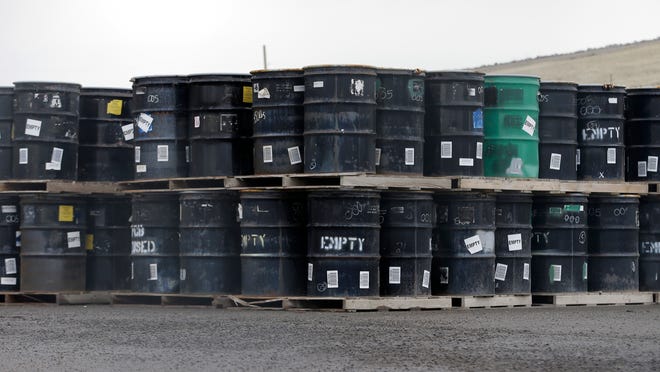 In this Wednesday, May 6, 2015, photo, drums holding low-level radioactive mixed waste before treatment and disposal are stacked at the EnergySolutions facility in Clive, Utah.