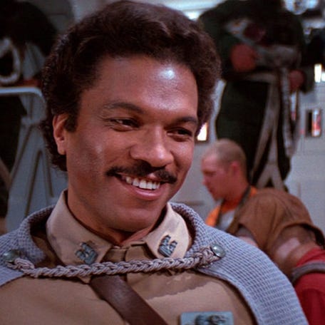 17. Lando Calrissian     • Wikipedia pageviews, 2015-2021:  2,678,760     • Star Wars movies appearance:  Episodes V, VI, IX, Solo Lando Calrissian is perhaps one of the coolest characters in Star Wars history, if not cinema history overall. Calrissian is a suave, classy character, who has worked as a gambler, hustler, and smuggler in his early life, often alongside Han Solo.  He eventually becomes the   administrator of Cloud City, where he double crosses Han Solo to save his citizens, before redeeming himself by helping the Rebellion in "Return of the Jedi" and later the Resistance in "The Rise of Skywalker." Calrissian is played by Billy Dee Williams in Episodes V, VI, IX, and by Donald Glover in "Solo: A Star Wars Story."     ALSO READ: Biggest Worldwide Box Office Hits of the Last 20 years
