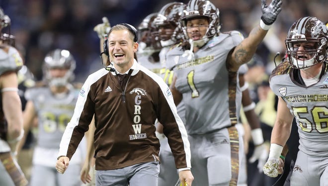 Western Michigan coach P.J. Fleck celebrates after a fumble by Ohio receiver Kyle Belack during the first half of the MAC title game Friday, Dec. 2, 2016 at Ford Field.