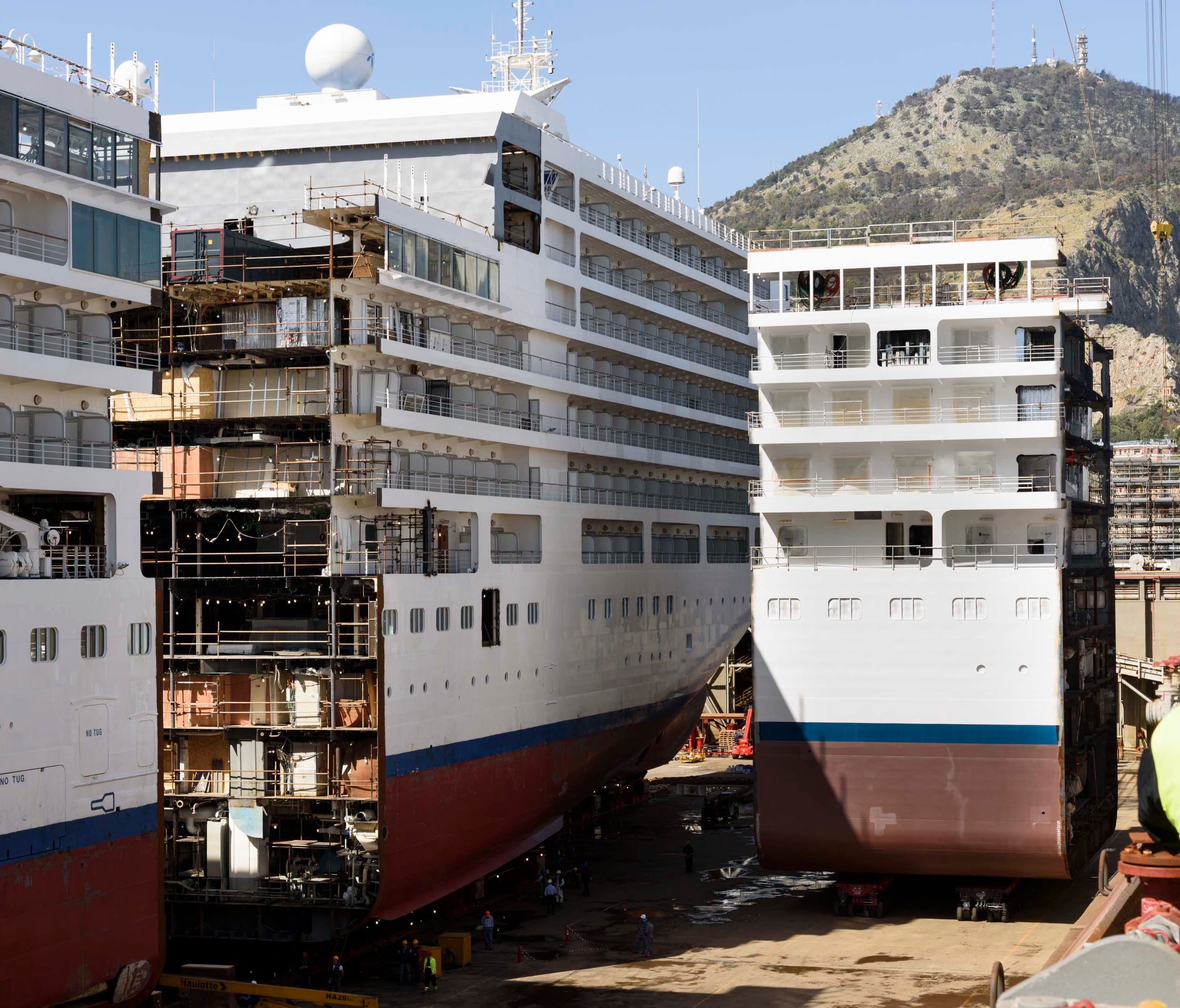 A new, 49-foot-long section is moved into position during a project to lengthen Silversea Cruises' Silver Spirit.