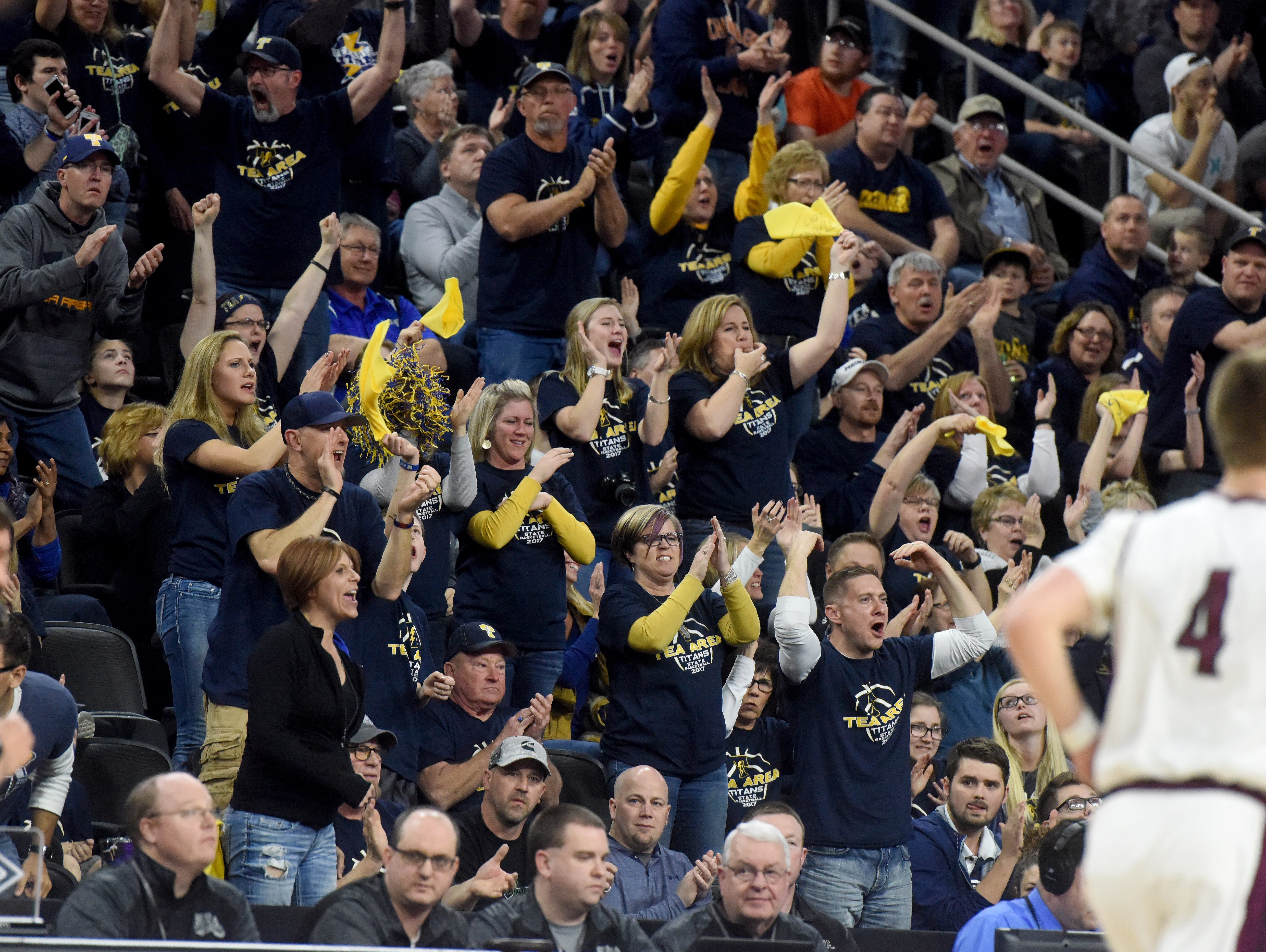 Tea Area fans go wild after scoring against Madison during the 2017 SDHSAA Class A boy's basketball championship at the Denny Sanford Premier Center on Saturday, March 18, 2017.