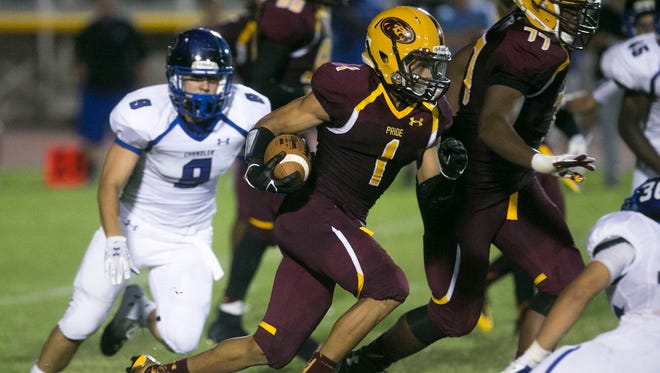 Mountain Pointe running back Paul Lucas carries the ball against Chandler during the second half on Friday, Sept. 19, 2014.