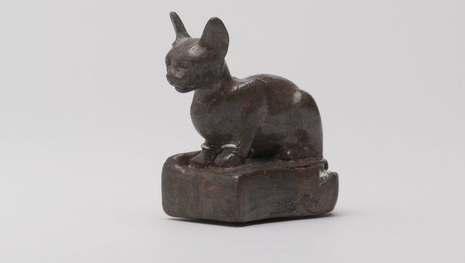 This weight form of a cat contains bronze, silver and lead. It is part of the "Divine Felines" exhibit opening at the University of Tennessee's McClung Museum of Natural History and Culture. This exhibition is organized by the Brooklyn Museum and the weight is courtesy of the Brooklyn Museum and the Charles Edwin Wilbour Fund.