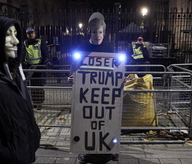 A protester holds a placard against President Trump's visit to the U.K. in London on Nov. 5, 2017.