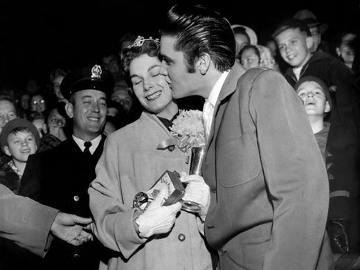 Clutching an Elvis Presley 'Love Me Tender' wrist watch, Sue Manker was all aflutter when the rock and roll king bussed her Nov. 30, 1956, at Crump Stadium. The singer was tardy and missed the opportunity to crown her as queen of half-time activities at the E.H. Crump Memorial Football Game for the Blind. But what a consolation prize!