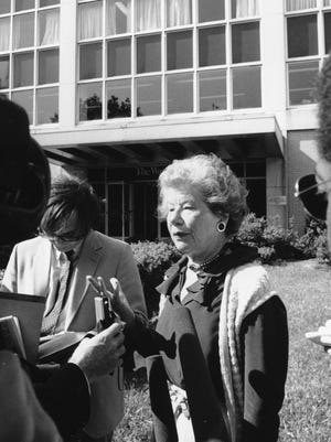 -

-Text: ** FILE ** Mary McGrory speaks to reporters about the closing of The Washington Star outside the building in Washington on July 23, 1981. McGrory was a political columnist for the paper. (AP Photo/Barry Thumma, File)