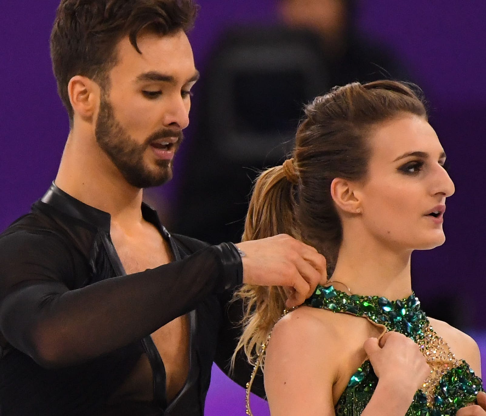 Gabriella Papadakis experiences a wardrobe malfunction as she and Guillaume Cizeron of France dance in the short program at the Olympics on Monday.