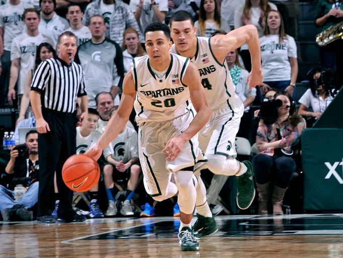 Travis Trice streaks up court with a steal.