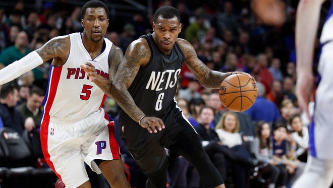 Brooklyn Nets guard Sean Kilpatrick (6) dribbles the ball against Detroit Pistons guard Kentavious Caldwell-Pope (5) during the second quarter at The Palace of Auburn Hills on March 30.