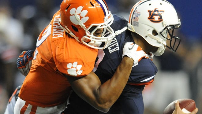 Clemson defensive end Vic Beasley (3) sacks Auburn quarterback Kiehl Frazier (10) late in the 4th quarter of the Chick-fil-A Kickoff Game Saturday, September 1, 2012 in Atlanta.