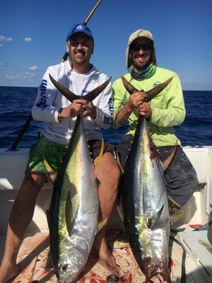 Chris Delaney of Melbourne, left, and Matt Badolato with a pair of yellowfin tuna caught with Scott Lehrmann aboard the Bloodstream during the 2016 Ed Dwyer's Otherside Invitational. Also on board was Chuck Burley of Indian Harbor Beach.