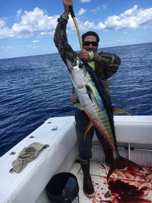 Matt Badolato with a 50-pound yellowfin tuna.