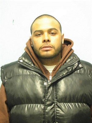 Julio Camacho, shown here in a 2009 police photo, was arrested in connection with two armed robberies on Sunday in Clifton and Passaic.