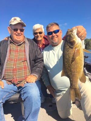 Paul, left, Lois and Jeff O'Dell behind a big Tomahawk area smallmouth bass.