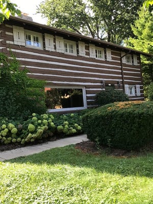 A log cabin rests on a lot at 2515 N. Wauwatosa Ave. The building is a historic Frederick D. Underwood log cabin which might be relocated for a housing development.
