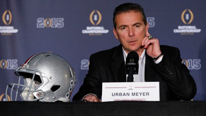 Ohio State football coach Urban Meyer answers questions during a news conference at the Renaissance Dallas Hotel.