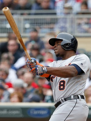 Detroit Tigers' Justin Upton (8) watches the flight of his three-run home run off Minnesota Twins starting pitcher Tyler Duffey during the first inning of a baseball game in Minneapolis, Saturday, April 30, 2016.