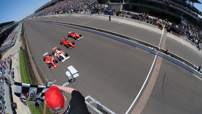 Driver Peter Dempsey, left, for Ireland wins the Indy Lights Firestone Freedom 100 auto race at the Indianapolis Motor Speedway May 24, 2013.