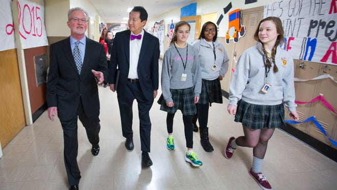 As part of Catholic Schools Week, McAuley High School, in College Hill, invited University of Cincinnati President Santa Ono for a visit and a chance to meet some of their students. (L-R) McAuley Principal Dan Minelli, Ono, Kylie Montgomery, freshman, Mirey Taite, sophomore and Katie Bergmann, sophomore.