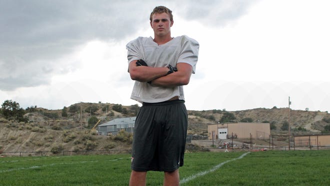 Aztec's Dylan Sutherland stands for a photo on Monday at the football practice field at Aztec High School.