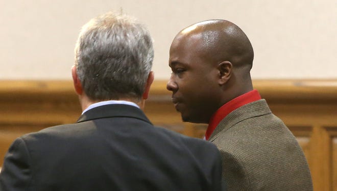 Defense attorney Nathan Spencer, left, stands with his client Everett Lamont Gray as the verdict is read in Judge Don Allen's courtroom at the J. Alexander Leech Criminal Justice Complex, on Friday, Nov. 13, 2015. Gray was found not guilty of rape, not guilty of sexual battery and guilty of assault by offensive touching.