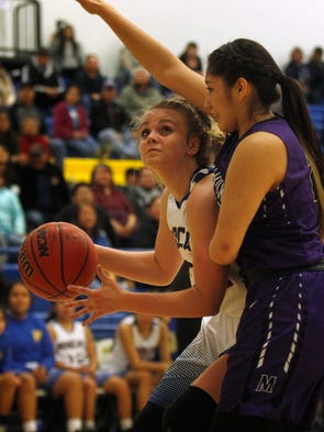 Bloomfields' Halle Payne attempts a shot against Miyamura