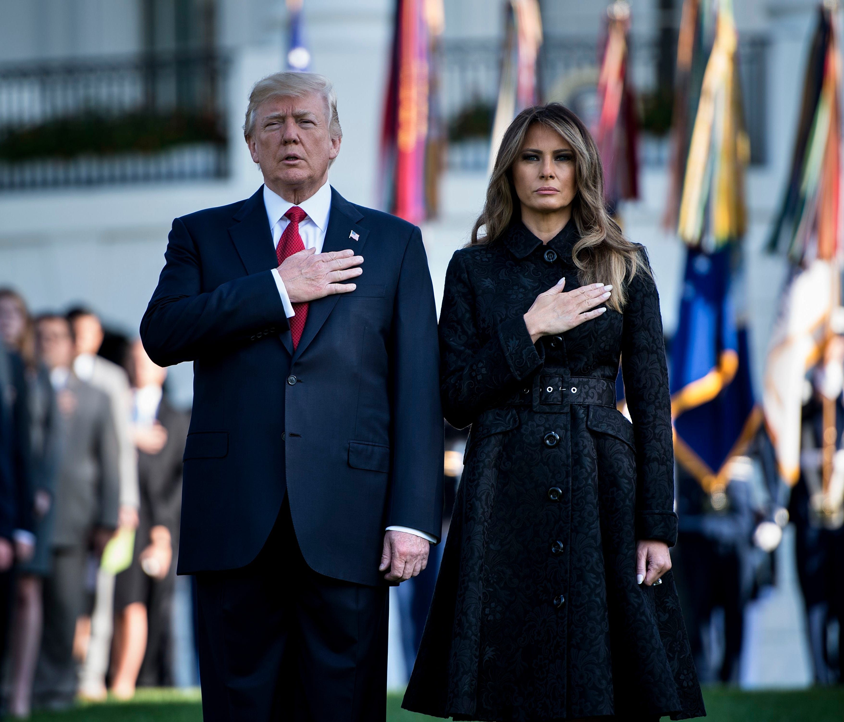 President Trump and First Lady Melania Trump observe a moment of silence at the White House Monday on the 16th anniversary of 9/11.