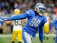 Lions defensive end Ziggy Ansah reacts after a sack