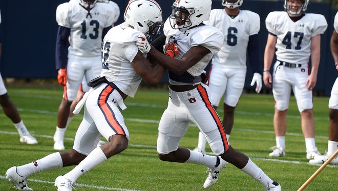 John Broussard Jr, left, and Smoke Monday, right, in drills Tuesday.
Auburn spring football practice on Tuesday, March 27, 2018 in Auburn, Ala.
