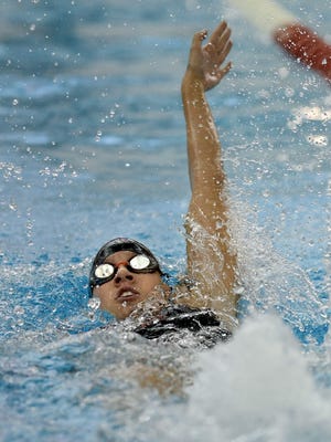 Hilton's Erica Hughes swims the 100 backstroke.