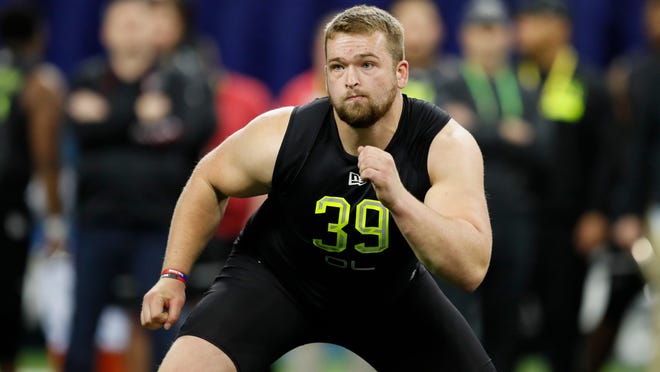 Ball State offensive lineman Danny Pinter runs a drill at the NFL football scouting combine in Indianapolis, Friday, Feb. 28, 2020. (AP Photo/Charlie Neibergall)
