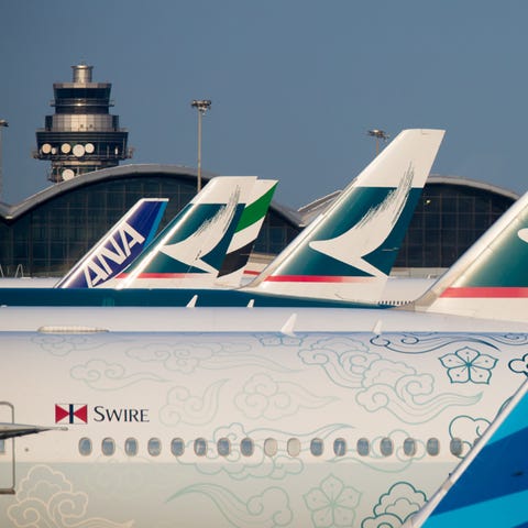 A gaggle of mostly Cathay Pacific tails dot the la