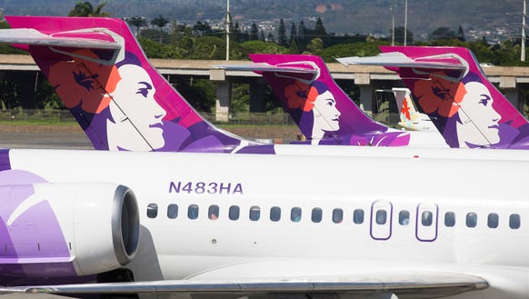 Hawaiian Airlines Boeing 717 jets park at the inter-island