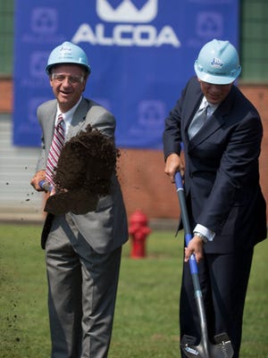 Gov. Bill Haslam, left, and Alcoa Inc. CEO Klaus Kleinfeld take part in a groundbreaking for a $275 million expansion of the Alcoa Inc. rolling mill to produce automotive sheet aluminum on Thursday, Aug. 29, 2013, in Alcoa.